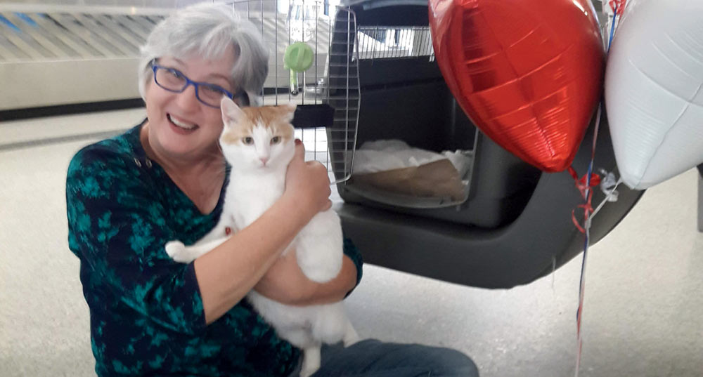 Photo of Mary Beth Dew & NEville the ca for the Search and Rescue: Pets Find Their Forever Homes in Mount Pleasant article