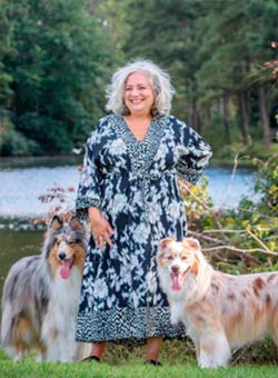 Zelda Bryant with Smokie the Collie (left) and Ruby the Australian Shepherd (right)
